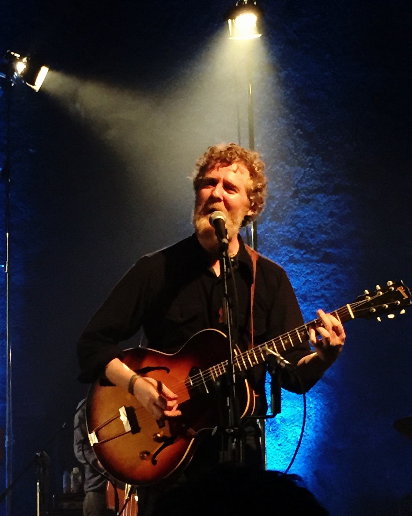 Glen Hansard singing and playing guitar live at Vicar Street